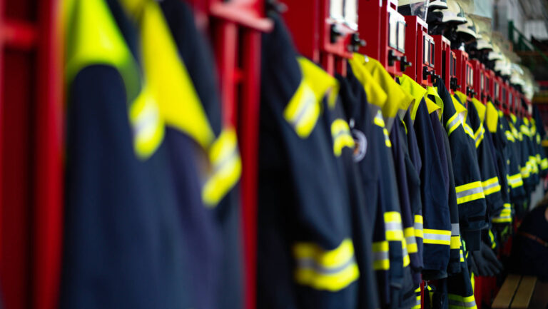 Firefighter Suits And Helmets At Fire Station